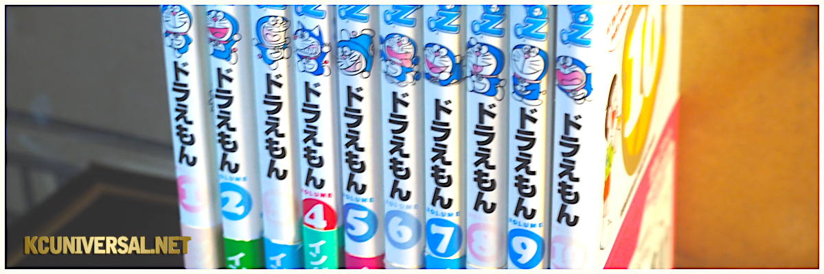 Food For the Saints blog post: On Collecting, featuring a picture of Kris Caballero's Doraemon English-Japanese comic book collection showing the spines of the manga.
