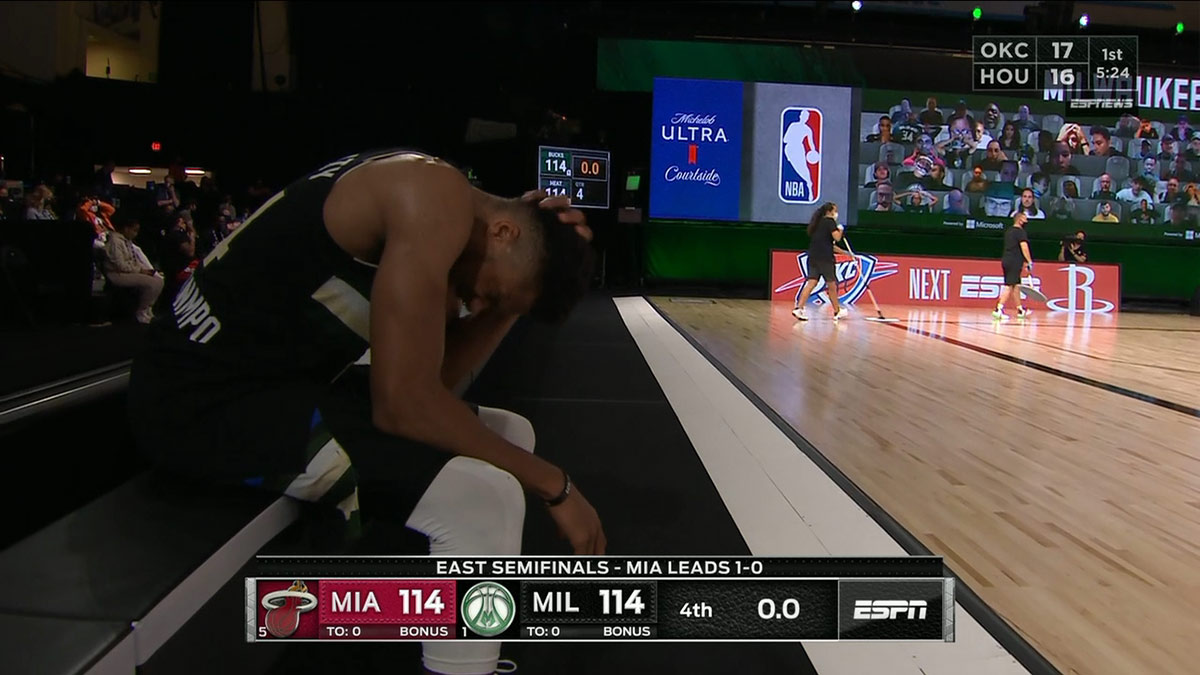 Giannis sitting by where the cameras are normally stationed at